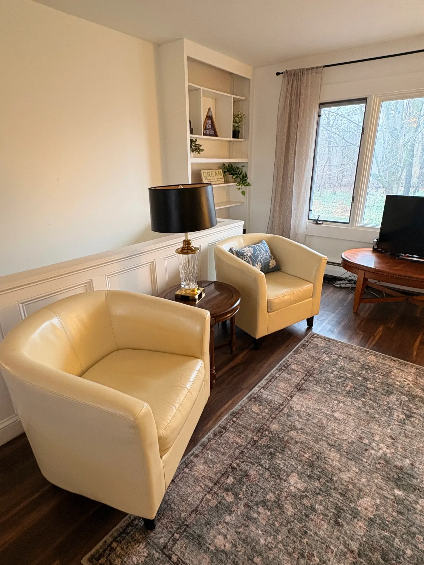 Living area with tan chairs